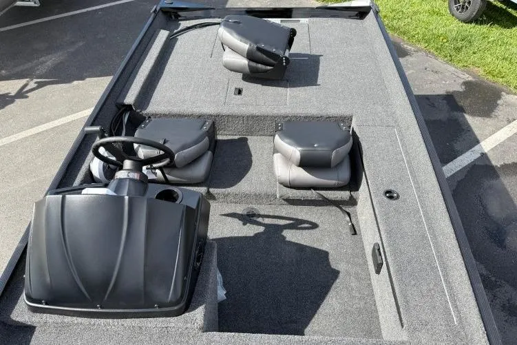 Slide: The Image of 2026 Crestliner 1700 Storm boat interior with steering console and seating. - 7