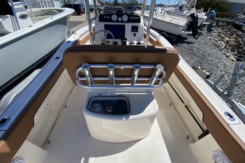Slide: The Image of 2023 Pioneer 202 Sportfish boat interior with console and rod holders. - 13
