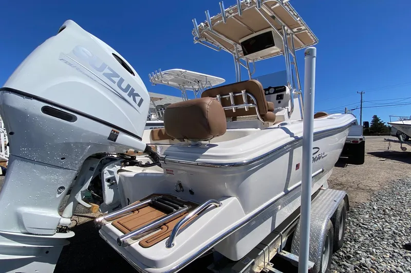 Slide: The Image of 2023 Pioneer 202 Sportfish boat with Suzuki outboard motor on trailer. - 4