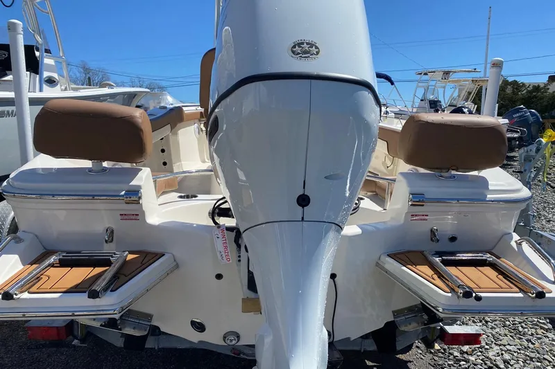 Slide: The Image of 2023 Pioneer 202 Sportfish boat rear view with dual seats and motor. - 8