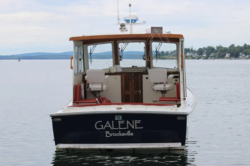 Slide: The Image of 1996 Webbers Cove 26 boat named "Galene" on calm waters near Brooksville. - 2