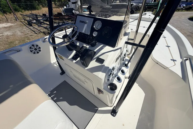 Slide: The Image of 2021 Bulls Bay 2200 boat interior with steering wheel and control panel. - 12