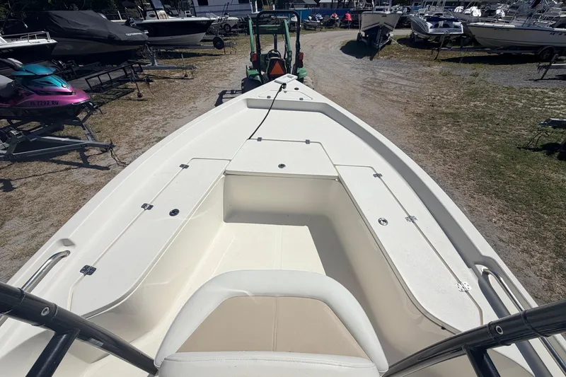 Slide: The Image of 2021 Bulls Bay 2200 boat deck view at a marina with surrounding boats. - 7