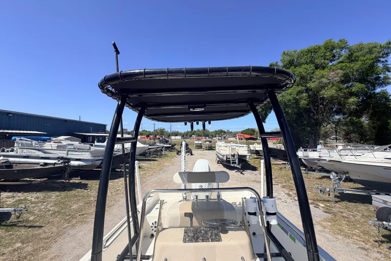 Slide: The Image of 2021 Bulls Bay 2200 boat in a marina, surrounded by other vessels under a clear blue sky. - 9