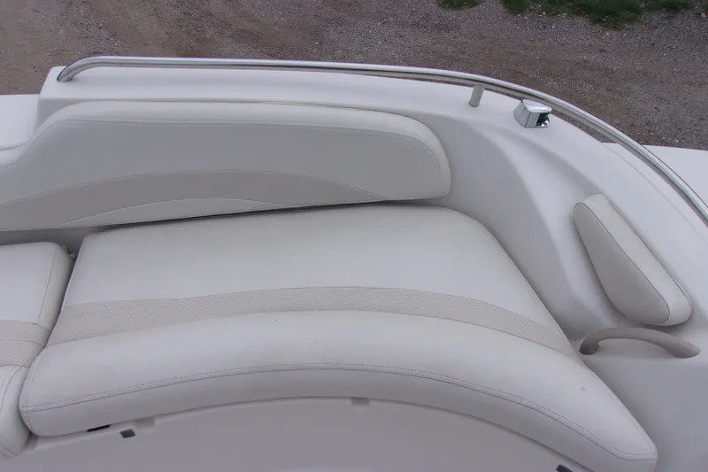 Slide: The Image of White leather seating on a 2004 Stardeck 201 boat, featuring sleek design and comfort. - 12