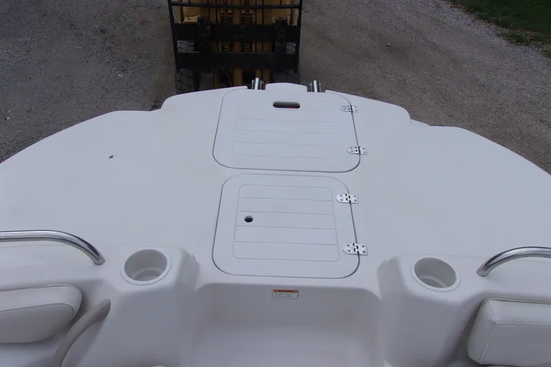 Slide: The Image of 2004 Stardeck 201 boat deck with storage compartments and cup holders. - 14