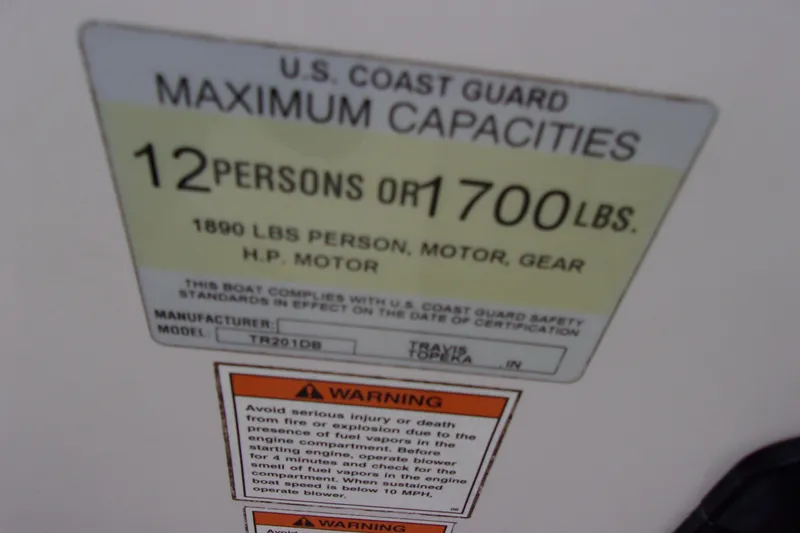 Slide: The Image of U.S. Coast Guard capacity label for Stardeck 201, 2004, 12 persons or 1700 lbs. - 16