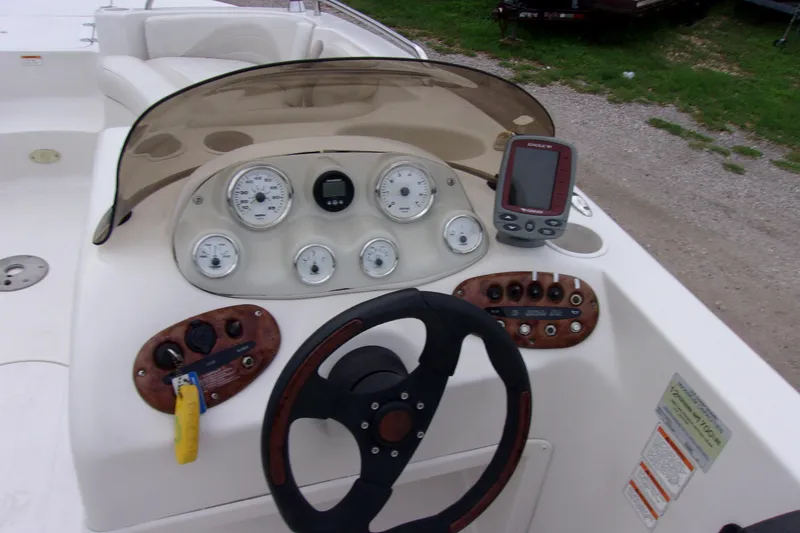 Slide: The Image of Dashboard of a 2004 Stardeck 201 boat with gauges and controls. - 6