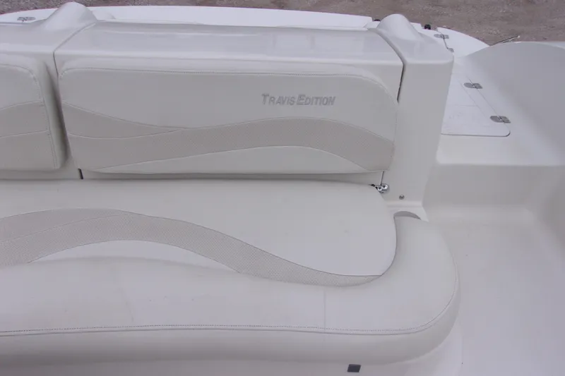 Slide: The Image of White leather seating on a 2004 Stardeck 201 boat, Travis Edition. - 9