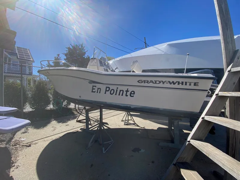Slide: The Image of 2001 Grady-White Sportsman 180 boat on a dock. - 2