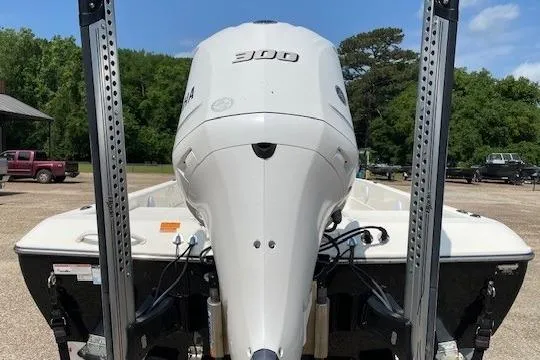 Slide: The Image of 2020 Skeeter SX240 boat with powerful outboard motor, parked outdoors. - 3