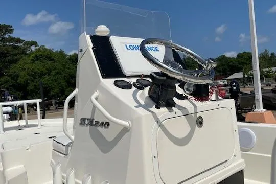 Slide: The Image of 2020 Skeeter SX240 boat console with steering wheel and Lowrance display. - 5
