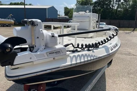 Slide: The Image of 2020 Skeeter SX240 boat with Minn Kota trolling motor on trailer. - 8