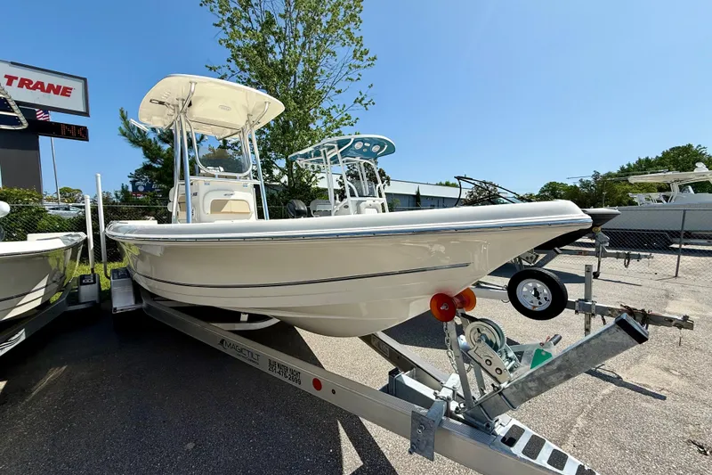 The Image of 2026 Bulls Bay 2400 boat on trailer, parked outdoors under clear blue sky. - 0