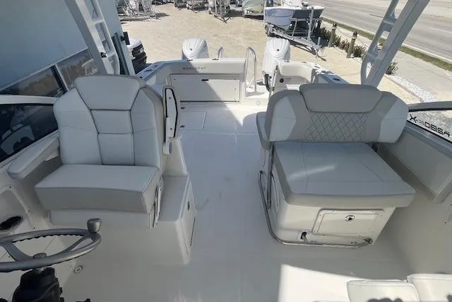 Slide: The Image of 2026 World Cat 280 DC-X boat interior with plush seating and modern design. - 5