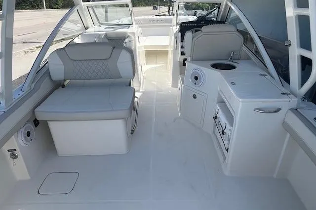 Slide: The Image of Interior of 2026 World Cat 280 DC-X boat with seating and amenities. - 7