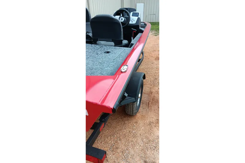 Slide: The Image of 2026 Tracker Pro Team 175 boat on trailer, featuring red exterior and spacious interior. - 16