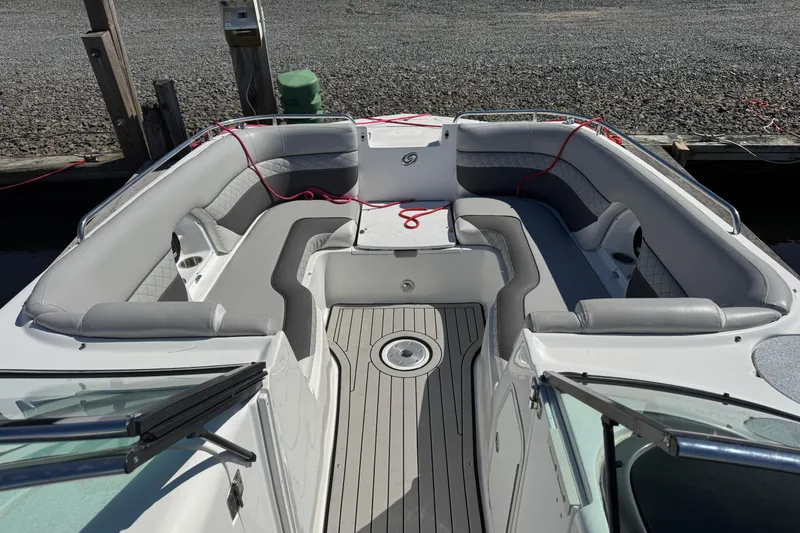 Slide: The Image of 2019 Hurricane SunDeck 2486 OB boat interior with spacious seating and sleek design. - 12