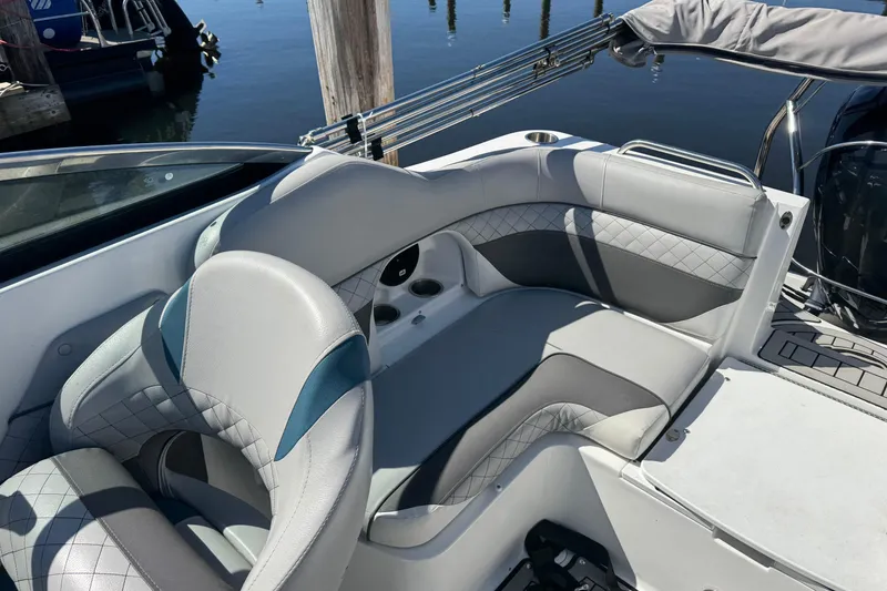 Slide: The Image of 2019 Hurricane SunDeck 2486 OB boat interior with stylish gray seating and cup holders. - 7