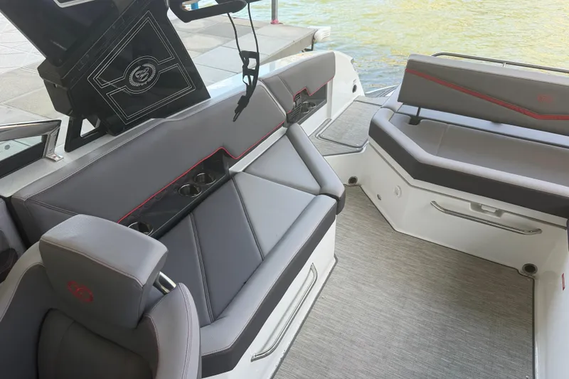Slide: The Image of Interior of 2022 Cobalt R8 Surf boat with gray seating and cup holders. - 10