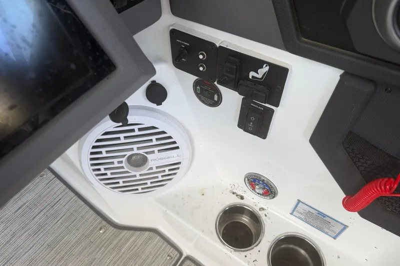 Slide: The Image of Control panel of 2022 Cobalt R8 Surf boat with speaker and cup holders. - 6