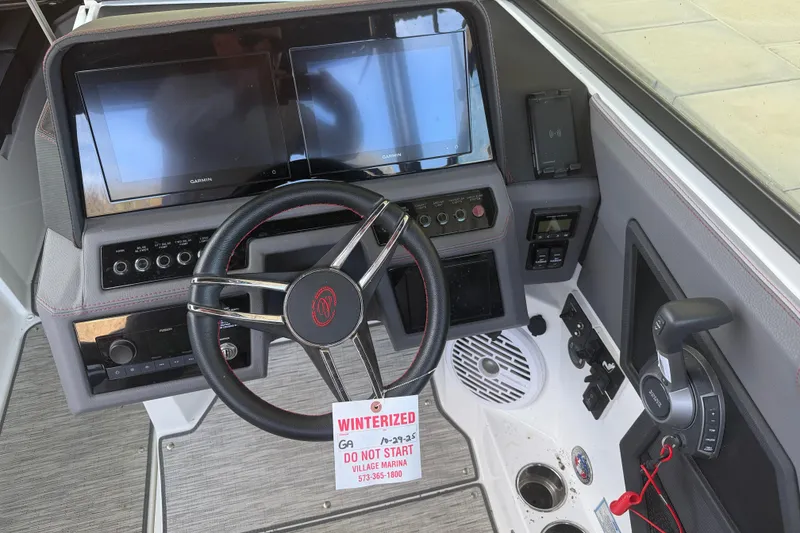 Slide: The Image of 2022 Cobalt R8 Surf boat dashboard with steering wheel and dual Garmin screens. - 7