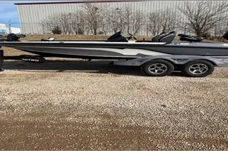 The Image of 2024 Nitro Z20 XL Pro boat on trailer, parked outdoors. - 0
