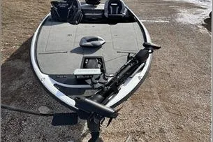 Slide: The Image of 2024 Nitro Z20 XL Pro fishing boat on a gravel surface. - 11