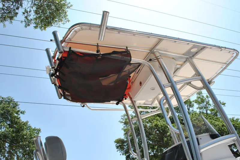 Slide: The Image of 2020 Sportsman Open 232 Center Console boat with T-top and storage net. - 12