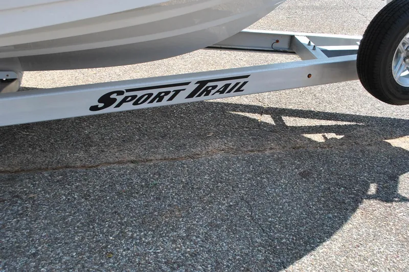 Slide: The Image of Trailer for 2020 Sportsman Open 232 Center Console boat on pavement. - 13
