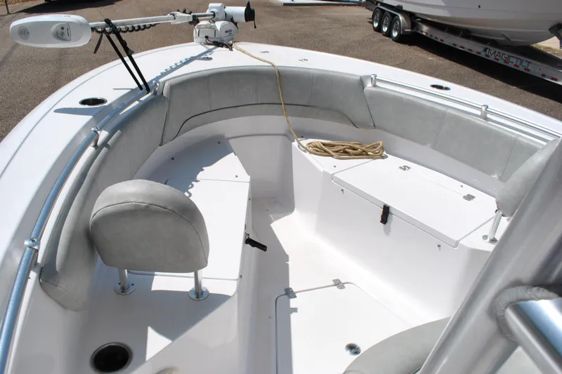 Slide: The Image of 2020 Sportsman Open 232 Center Console boat interior with seating and storage. - 14