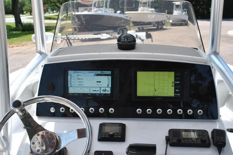 Slide: The Image of 2020 Sportsman Open 232 Center Console dashboard with navigation screens and controls. - 17