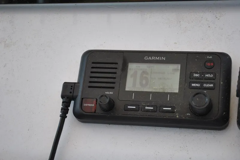 Slide: The Image of Garmin marine radio on 2020 Sportsman Open 232 Center Console boat dashboard. - 18