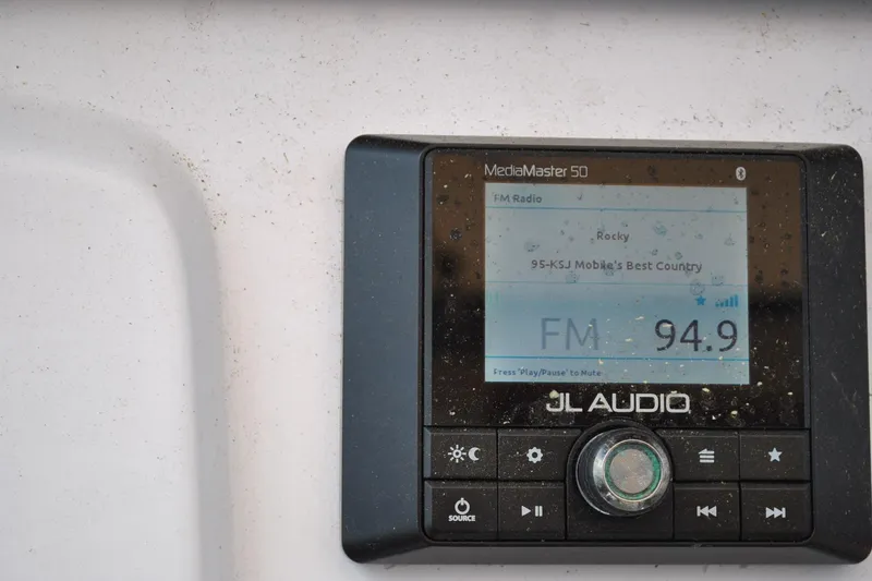 Slide: The Image of JL Audio MediaMaster 50 radio display on 2020 Sportsman Open 232 Center Console boat. - 19