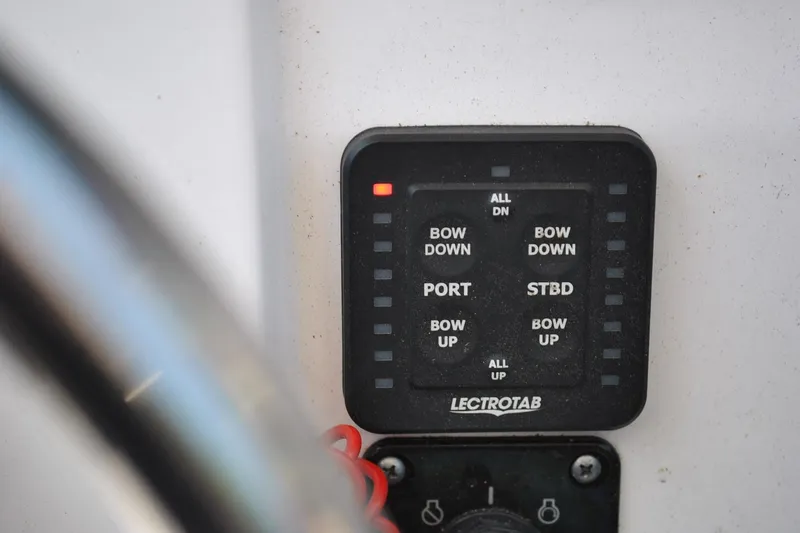Slide: The Image of Control panel of a 2020 Sportsman Open 232 Center Console boat. - 20