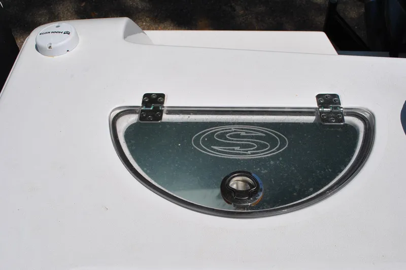 Slide: The Image of 2020 Sportsman Open 232 Center Console boat detail with logo and hatch. - 27