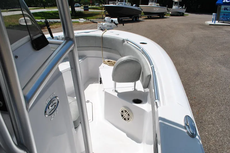 Slide: The Image of 2020 Sportsman Open 232 Center Console boat interior with seating and steering console. - 28