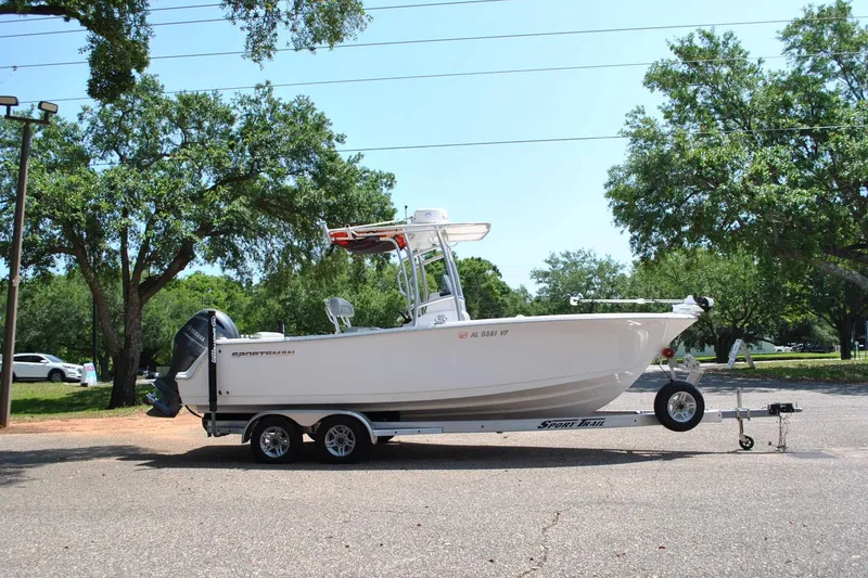 Slide: The Image of 2020 Sportsman Open 232 Center Console boat on trailer, parked outdoors. - 5