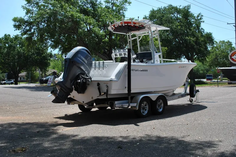 Slide: The Image of 2020 Sportsman Open 232 Center Console boat on trailer, parked outdoors. - 7