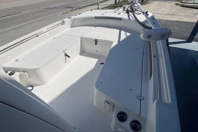 Slide: The Image of 2022 World Cat 235 CC boat interior, featuring spacious seating and storage compartments. - 4