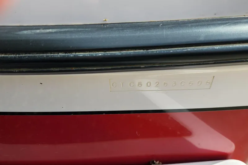 Slide: The Image of Close-up of a 2006 Correct Craft 196 boat hull identification number. - 9