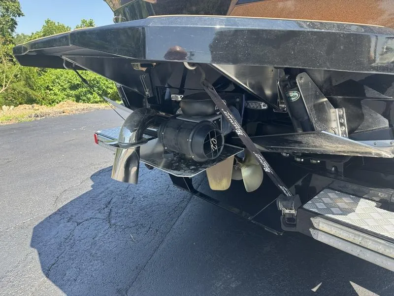 Slide: The Image of Rear view of a 2020 Supra 450 SE boat's propulsion system and propeller. - 11