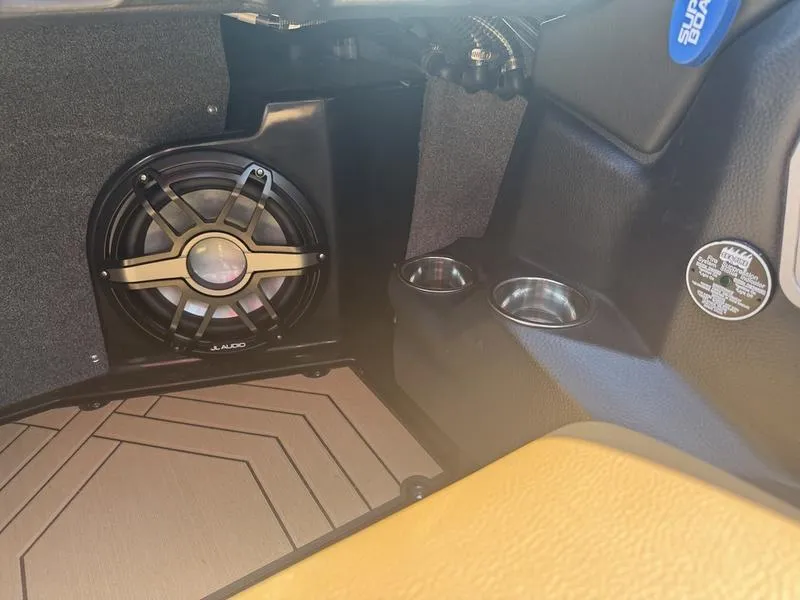 Slide: The Image of 2020 Supra 450 SE interior with JL Audio speaker and cup holders. - 12
