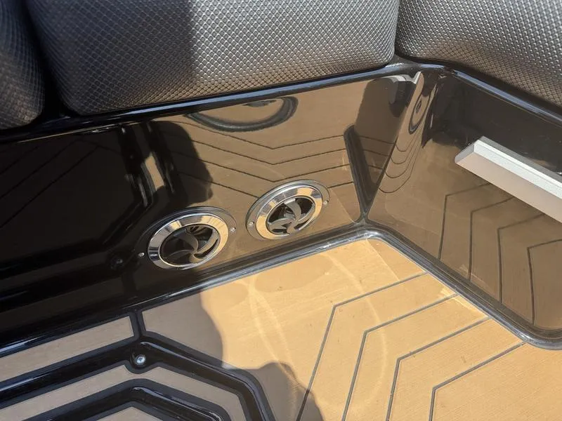 Slide: The Image of 2020 Supra 450 SE interior detail with air vents and textured flooring. - 18