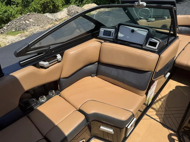 Slide: The Image of Luxurious interior of a 2020 Supra 450 SE boat with tan and black seating. - 4