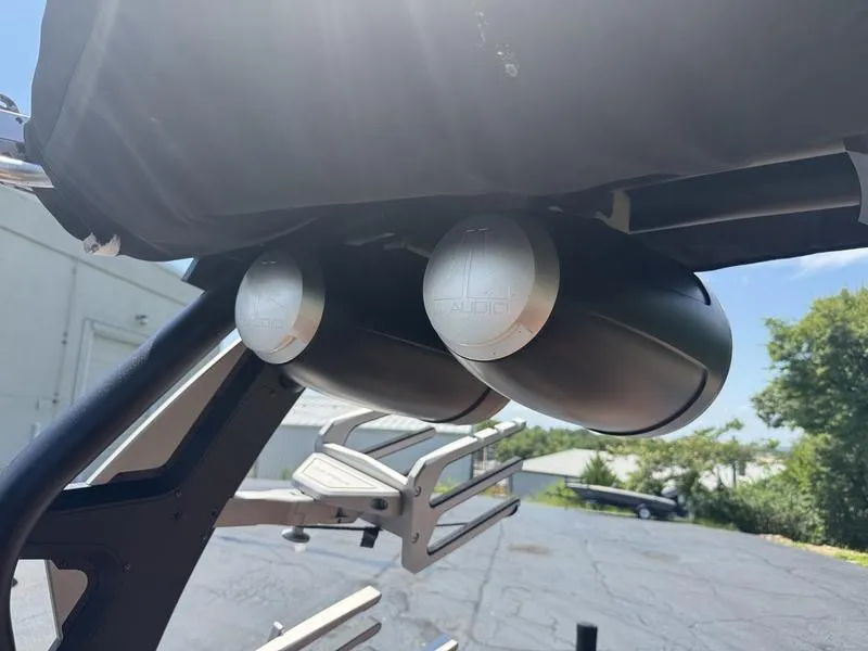 Slide: The Image of Speakers mounted on a 2020 Supra 450 SE boat, under a sunny sky. - 5