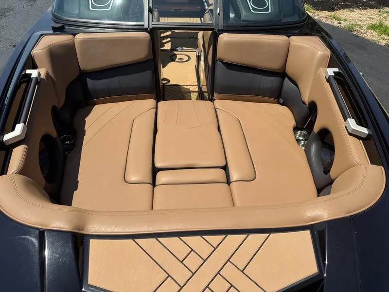 Slide: The Image of 2020 Supra 450 SE boat interior with tan leather seating and modern design. - 7