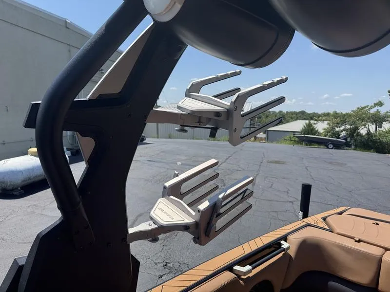 Slide: The Image of Wakeboard racks on a 2020 Supra 450 SE boat, parked outdoors. - 8