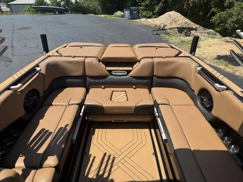 Slide: The Image of 2020 Supra 450 SE boat interior with tan leather seating and modern design. - 9