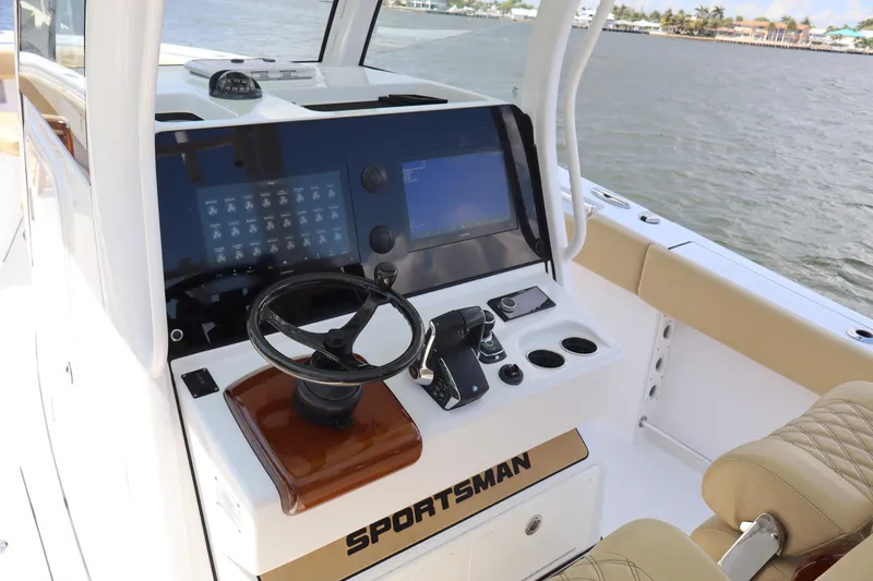 Slide: The Image of 2025 Sportsman Open 322 Center Console boat dashboard with advanced controls and navigation system. - 10